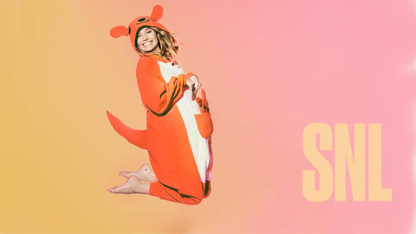 Margot Robbie jumping in air with kangaroo onesie